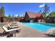 Exterior of the community pool features lounge chairs and beautiful trees at 305 S Park Ave # 402, Breckenridge, CO 80424