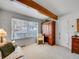 Bright bedroom featuring natural light, wood beam, and neutral carpet at 1011 N Pennsylvania St # H, Denver, CO 80203