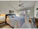Bedroom featuring large window, ceiling fan and comfortable bed at 1011 N Pennsylvania St # H, Denver, CO 80203