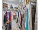 Organized walk-in closet with hanging clothes and shelving at 1011 N Pennsylvania St # H, Denver, CO 80203