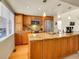 Charming kitchen with wood cabinets, granite countertops, stainless steel appliances, and natural light from a window at 1011 N Pennsylvania St # H, Denver, CO 80203