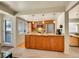 Inviting kitchen features wood cabinets, stainless steel appliances, and an open layout with access to the dining area at 1011 N Pennsylvania St # H, Denver, CO 80203