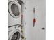 Bright laundry area featuring stacked washer and dryer units with a clean, organized space at 1011 N Pennsylvania St # H, Denver, CO 80203