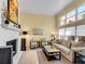 Inviting living room with fireplace, neutral tones, and ample natural light at 1011 N Pennsylvania St # H, Denver, CO 80203
