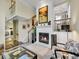 Cozy living room with fireplace, comfortable seating, and stairway access at 1011 N Pennsylvania St # H, Denver, CO 80203