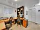 Large home office with two desks, natural light, carpet and shelving at 1011 N Pennsylvania St # H, Denver, CO 80203