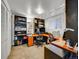 Spacious home office featuring carpet, built-in shelving, and ample desk space at 1011 N Pennsylvania St # H, Denver, CO 80203