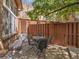 Cozy outdoor patio with dining set, privacy fence, and brick exterior at 1011 N Pennsylvania St # H, Denver, CO 80203