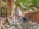 Inviting outdoor patio with brick accents, mature trees, and stylish seating at 1011 N Pennsylvania St # H, Denver, CO 80203