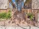 Brick stairway leading to the property, with landscaping and metal railings at 1011 N Pennsylvania St # H, Denver, CO 80203