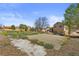Expansive backyard featuring a concrete slab, mature trees, and potential for landscaping projects at 1853 S Zeno Way, Aurora, CO 80017