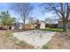 Backyard with two storage sheds and a concrete slab, enclosed by a wooden fence for privacy at 1853 S Zeno Way, Aurora, CO 80017