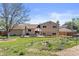 Large backyard with a concrete patio, perfect for entertaining, and a lush lawn area at 1853 S Zeno Way, Aurora, CO 80017