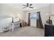 Bedroom with ceiling fan, carpet, and a desk by the window at 1853 S Zeno Way, Aurora, CO 80017