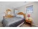 Comfortable bedroom with natural light, a full bed, and matching nightstands at 1853 S Zeno Way, Aurora, CO 80017