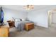 Carpeted bedroom with light blue walls and a ceiling fan at 1853 S Zeno Way, Aurora, CO 80017