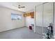 Bedroom features tile flooring, mirrored closet, and convenient overhead storage at 1853 S Zeno Way, Aurora, CO 80017