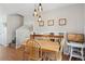 Cozy dining area with table and chairs, staircase in background at 1853 S Zeno Way, Aurora, CO 80017