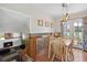 Cozy dining area with table, chairs, and views of a backyard patio at 1853 S Zeno Way, Aurora, CO 80017