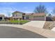 Charming two-story home with beautiful landscaping and an attached two-car garage at 1853 S Zeno Way, Aurora, CO 80017
