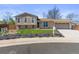 Charming two-story home with beautiful landscaping and an attached two-car garage at 1853 S Zeno Way, Aurora, CO 80017
