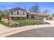 Charming two-story home with beautiful landscaping and an attached two-car garage at 1853 S Zeno Way, Aurora, CO 80017