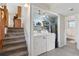Bright laundry room with washer, dryer, and a convenient shelving at 1853 S Zeno Way, Aurora, CO 80017