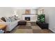 Comfortable living room with a fireplace, modern furniture, and television at 1853 S Zeno Way, Aurora, CO 80017