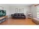 Comfortable living room with hardwood floors, neutral walls, and plenty of natural light at 1853 S Zeno Way, Aurora, CO 80017