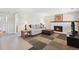 Cozy living room with a fireplace, comfortable sofa, and lots of natural light at 1853 S Zeno Way, Aurora, CO 80017