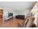 Comfortable living room with hardwood floors, neutral walls, and plenty of natural light at 1853 S Zeno Way, Aurora, CO 80017