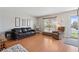 Comfortable living room with hardwood floors, neutral walls, and plenty of natural light at 1853 S Zeno Way, Aurora, CO 80017