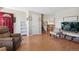 Comfortable living room with hardwood floors, neutral walls, and plenty of natural light at 1853 S Zeno Way, Aurora, CO 80017