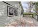 Back deck showcasing the home's exterior and surrounding greenery at 29762 Spruce Rd, Evergreen, CO 80439