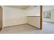 Carpeted bedroom features neutral paint color, trim, and a large window at 29762 Spruce Rd, Evergreen, CO 80439