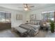 This bedroom features soft gray hues with detailed wall art and a neutral color palette at 29762 Spruce Rd, Evergreen, CO 80439