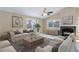 Living room featuring a fireplace, neutral tones, and lots of seating, perfect for relaxing or entertaining at 29762 Spruce Rd, Evergreen, CO 80439