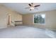 Second floor living room with neutral carpet, vaulted ceiling, and lots of natural light at 29762 Spruce Rd, Evergreen, CO 80439