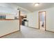 Open living space with view into kitchen and bathroom at 29762 Spruce Rd, Evergreen, CO 80439