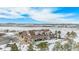 An aerial view of a ranch property with a house, shop, and snow-covered grounds at 4075 Merada Ct, Franktown, CO 80116