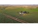 Expansive property with a custom home, fields, and mountain views in the distance at 4075 Merada Ct, Franktown, CO 80116