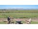 Picturesque backyard with a fire pit and mountain views, perfect for enjoying nature's beauty at 4075 Merada Ct, Franktown, CO 80116