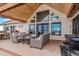 Spacious deck with seating area and outdoor kitchen at 4075 Merada Ct, Franktown, CO 80116