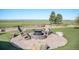 Inviting backyard featuring a fire pit and scenic views, creating a tranquil outdoor retreat at 4075 Merada Ct, Franktown, CO 80116