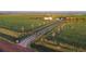 A long drive leads to this beautiful farm with a two-rail fence at 4075 Merada Ct, Franktown, CO 80116