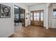Bright entryway with hardwood floors and view into an adjacent room at 4075 Merada Ct, Franktown, CO 80116