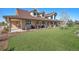 Charming home featuring a covered porch with ample seating, perfect for relaxing outdoors at 4075 Merada Ct, Franktown, CO 80116