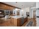 Open kitchen with island, stainless steel appliances, and white cabinets at 4075 Merada Ct, Franktown, CO 80116