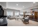Spacious living room with a large sectional sofa and a cozy atmosphere perfect for relaxation and entertainment at 4075 Merada Ct, Franktown, CO 80116
