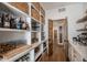 Organized pantry with ample shelving, baskets, and stylish decor at 4075 Merada Ct, Franktown, CO 80116